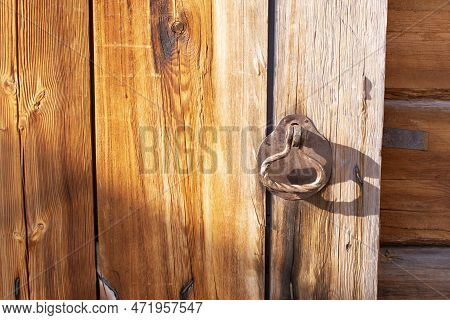Metal Handle In Wooden Doors. Ancient Wooden Architecture. Irkutsk Architectural And Ethnographic Mu