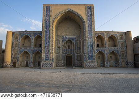 Facade Of The Ancient Ulugbek Madrasah On A Sunny Morning. Bukhara, Uzbekistan