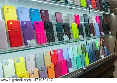 Showcase With Cases For Smartphones. Shop For Mobile Accessories, Display Of Plastic Mobile Phone Ca