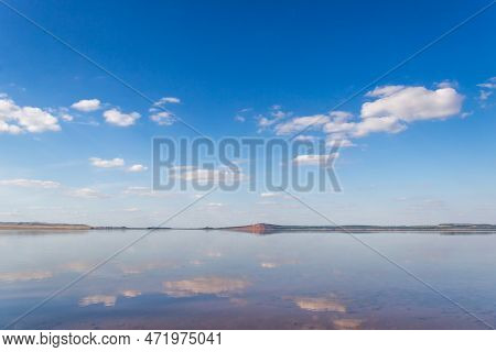 Lake With A Sky, Red Hill With Forests On Background.