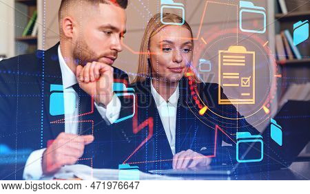 Businessman And Businesswoman Typing In Laptop, Double Exposure With Online Documentation System And