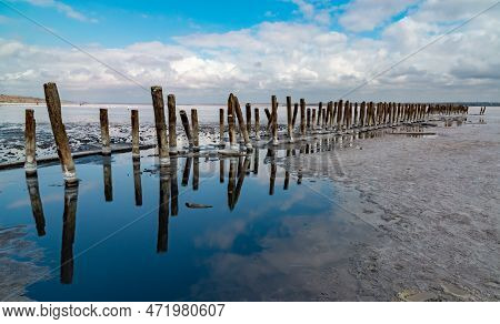Salt Crystals On Wooden Pillars Of An Old 18Th Century Salt Industry. The Ecological Problem Is Drou
