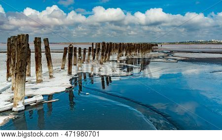Salt Crystals On Wooden Pillars Of An Old 18Th Century Salt Industry. The Ecological Problem Is Drou