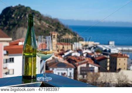 Tasting Of Txakoli Or Chacolí Slightly Sparkling Very Dry White Wine Produced In Spanish Basque Coun