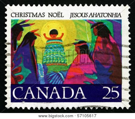 CANADA - CIRCA 1977: a stamp printed in the Canada shows Christ Child in Ring of Glory Blessing Chiefs from Afar, Illustration for Canada's first Christmas Carol, by Father Brebeuf, circa 1977
