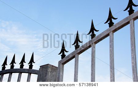 Closeup Of Decorative Security Spikes On Gate