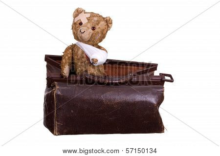 Old Sick Teddybear On Suitcase