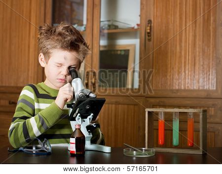 Little boy making science experiments.