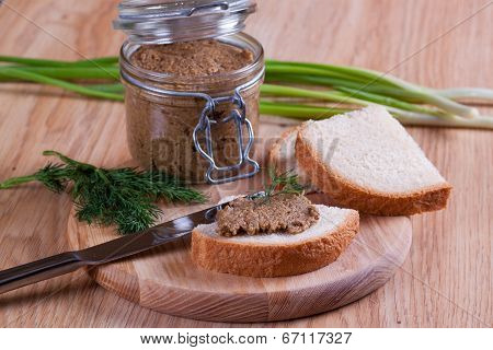 Sandwiches with pate, with glass jar on a background