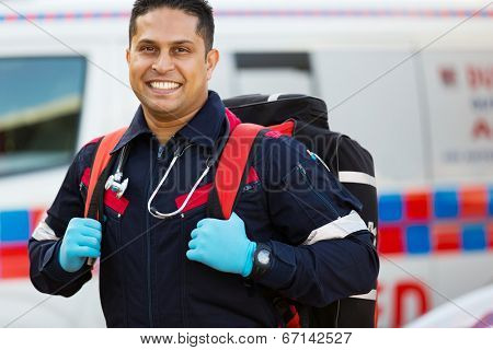 happy emergency medical service staff carrying equipment