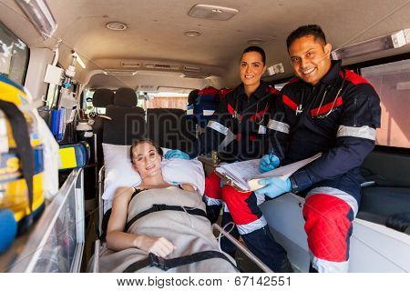 friendly paramedic team and patient inside an ambulance