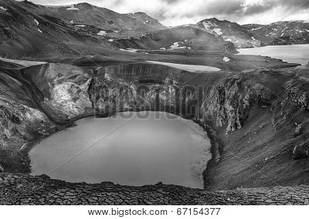Giant volcano Askja offers a view at two crater lakes. The smaller one is called Viti and contains warm geothermal water and is good for swimming. The large lake is Oskjuvatn. Black and white