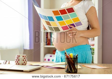 Pregnant woman working from home