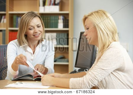 College tutor with student
