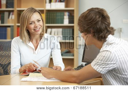 College tutor with student