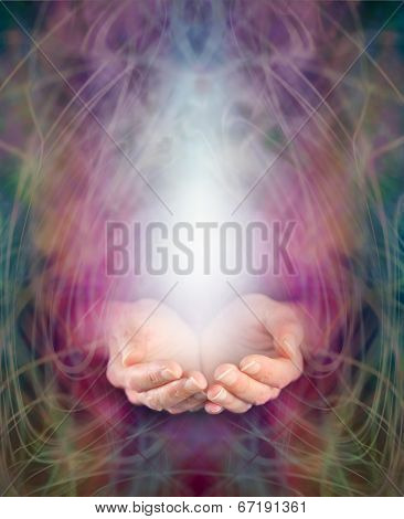 Healer's cupped hands and energy manifestation