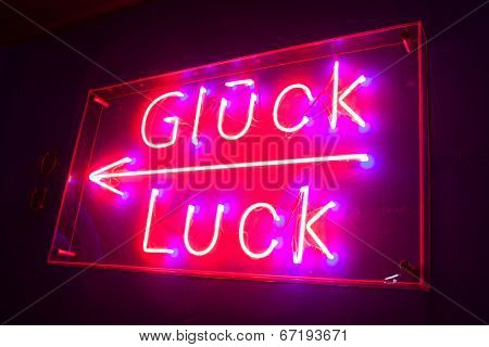 neon board with illuminated Luck text