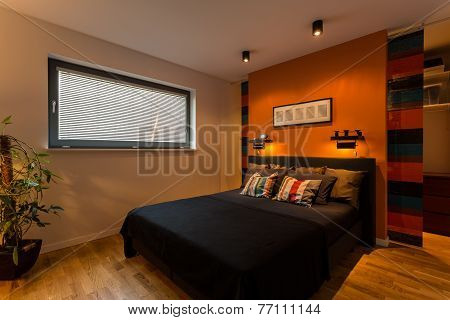 Designer Bedroom With Orange Wall
