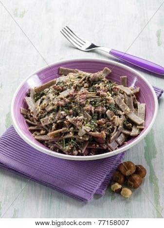 pizzocheri with sausage spinach and hazelnut