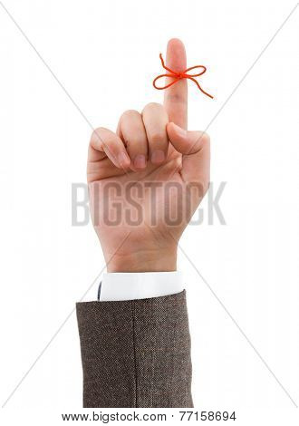 Red bow on finger isolated on white background