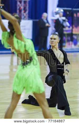 Minsk-belarus, October 4,2014: Unidentified Professional Dance Couple Performs Youth-2 Latin-america