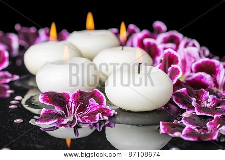 Beautiful Spa Concept Of Geranium Flower, Beads And Candles In Reflection Water, Closeup