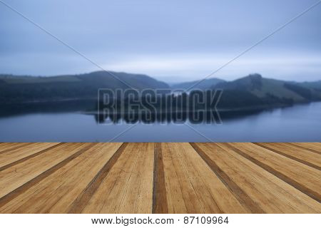 Moody Landscape Image Of Lake Pre-dawn In Autumn With Haunting Feel With Wooden Planks Floor