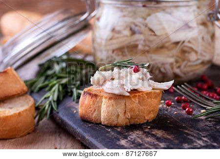 Chicken Pate In Glass Jar And Toast Bread On Rustic Kitchen Board