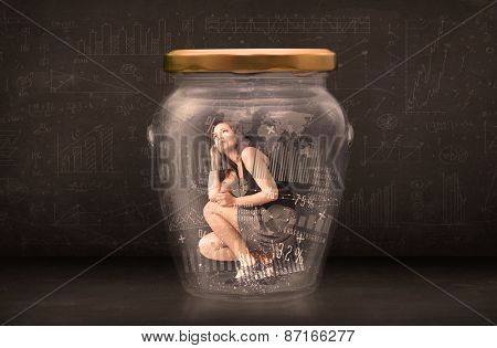Businesswoman traped in jar with graph chart symbols concept on background