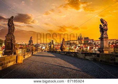 Charles bridge with statues and Prague castle on surise. Prague, Czech Republic