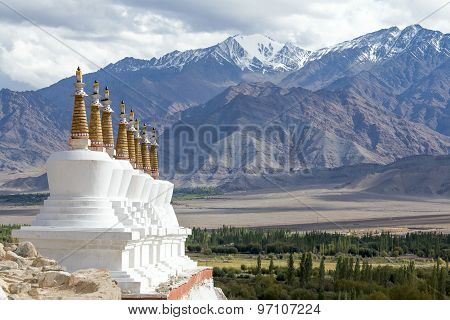Buddhist Chortens (stupa) And Himalayas Mountains In The Background Near Shey Palace In Ladakh, Indi