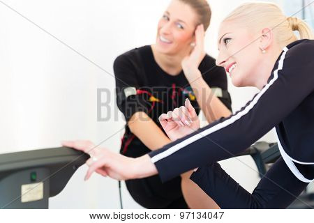 Female coach woman nms electro muscular stimulation exercise 