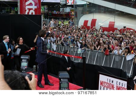 NEW YORK-JUL 27: Actor Tom Cruise waves to the crowd at the US Premiere of 'Mission: Impossible - Rogue Nation' in Times Square on July 27, 2015 in New York City.