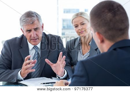 Business people conducting an interview in an office