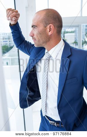 Serious businessman looking away in the offie