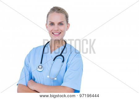 Portrait of blond female doctor against white background
