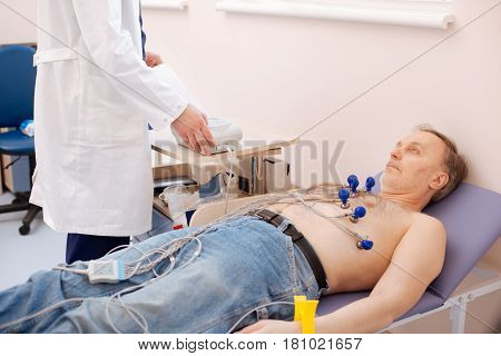 Not more than 5 minutes. Young trained qualified specialist running a diagnostics for his patient while he lying on bed and trying not moving