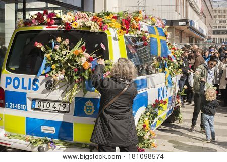 STOCKHOLM, SWEDEN - April 09, 2017: Flowers on a police van. truck attack in central Stockholm, Sweden