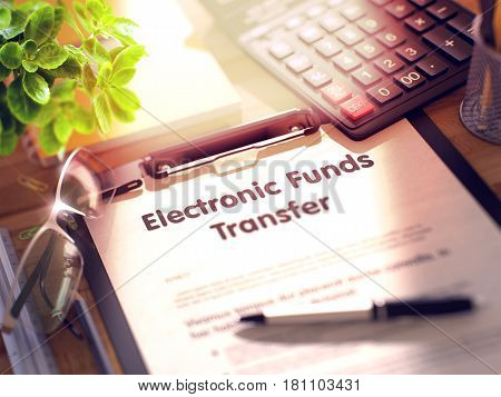 Electronic Funds Transfer on Clipboard. Wooden Office Desk with a Lot of Business and Office Supplies on It. 3d Rendering. Blurred and Toned Illustration.