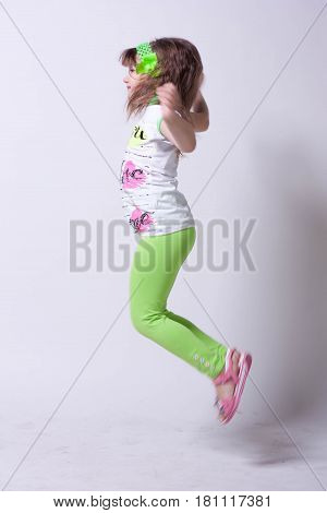 Little beautiful girl on a white background