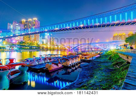 Xindian riverside bridges and architecture at night in Taipei