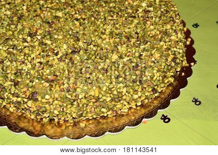 Chocolate Cake Topped With Chopped Pistachios And Pistachio Cream