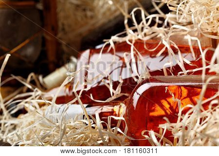 Whisky Bottle.in Wooden Container For Trasporting Closeup.selective Focus
