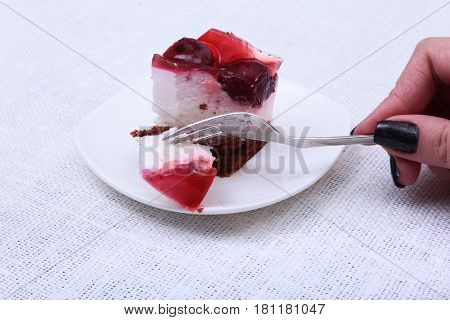 Slice of handmade cherry pie on a plate and classic espresso coffee in white background.