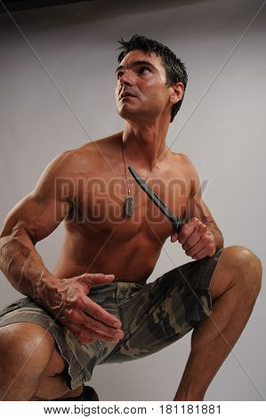 The tough marine is prepared for battle.