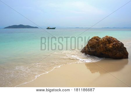 paradise sea landscape with white sand and emerald ocean shore in Rawa Island Malaysia on a summer day in holiday resort and tropical vacation trip and travel destination concept