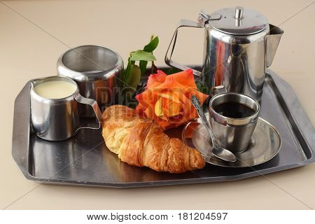 Romantic breakfast in bed. Coffee set, rose, crisp with egg on a silver tray. Healthy concept. Love. Romance