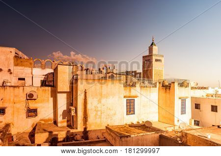 View of the Al-Zaytuna Mosque and the skyline of Tunis at dawn. The mosque is a Landmark of Tunis. Tunisia, North africa.