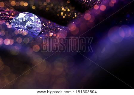 Glitter and glow soft multi colored bokeh shining with big natural jewelry precious stone. Dark abstract dreamy wunderful sparkle background
