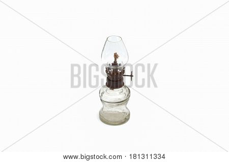 Old dusty oil lamp isolated on white background